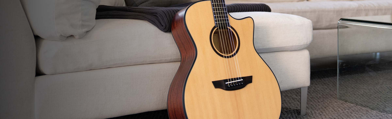 oliver mahogany guitar on a kitchen counter